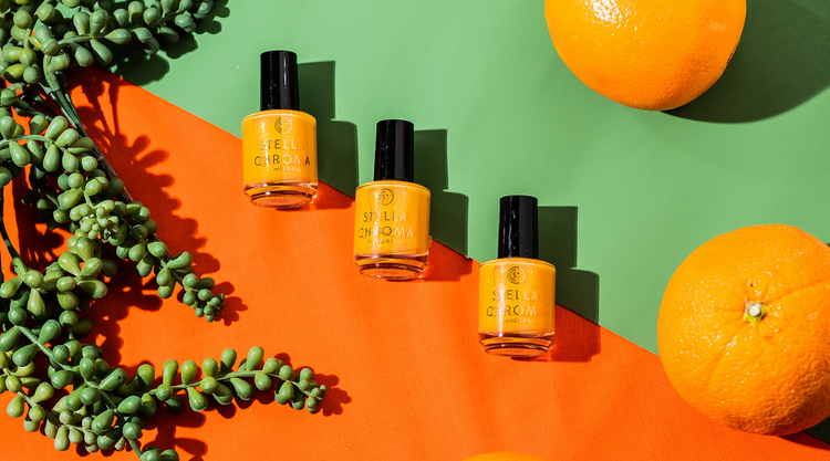 three bottles of cactus bloom nail polish on a green and orange background